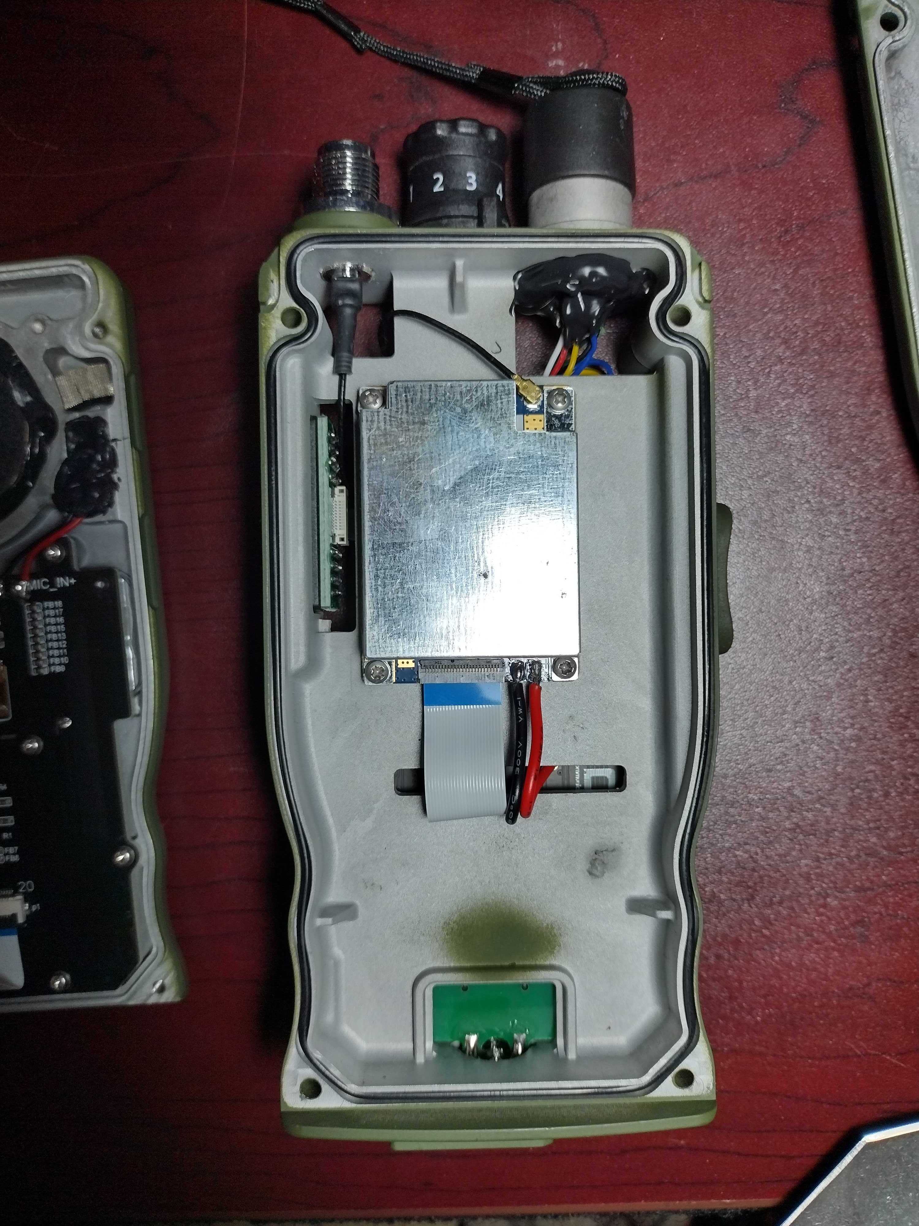 The radio with the black plate removed, showing the RF module